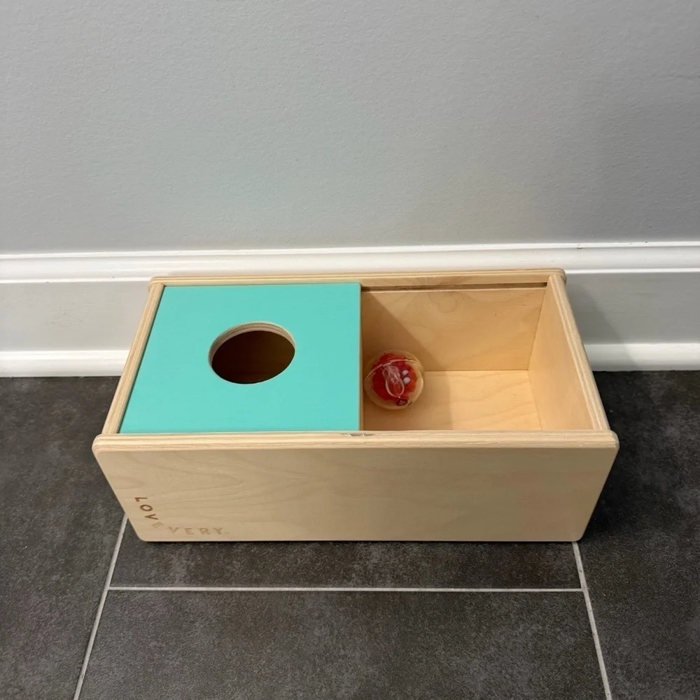 Lovevery Sliding Top Box with Plastic Rattle Ball from the Thinker Play Kit